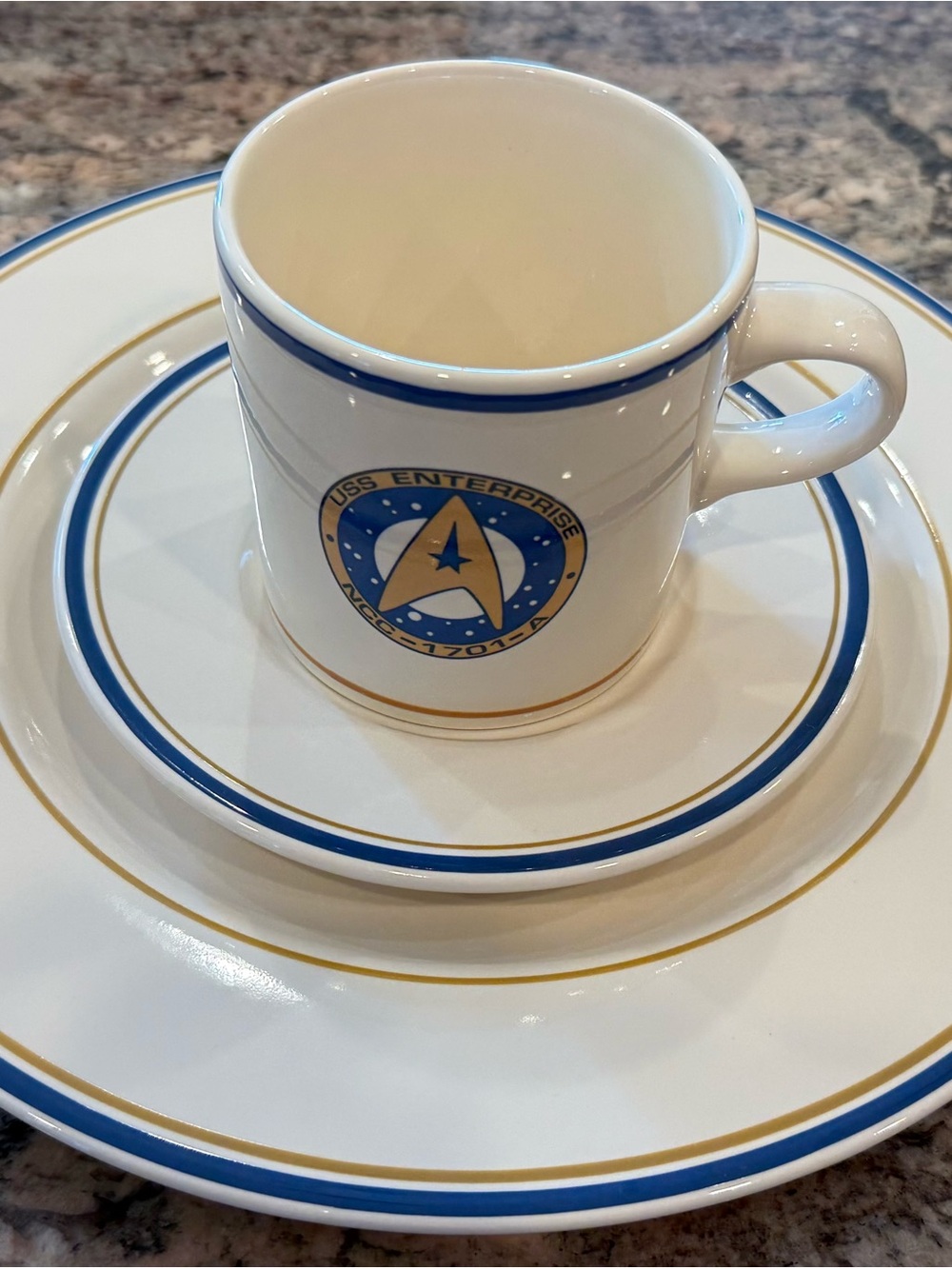 USS Enterprise Branded White Ceramic Mug with Blue and Gold Accents